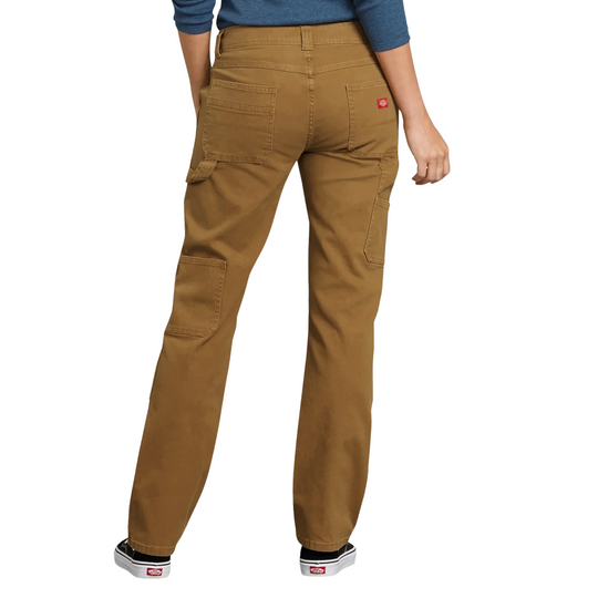 Dickies Women's Flex Relaxed Fit Duck Carpenter Pants - Rinsed Brown Duck on a female model on a white background.