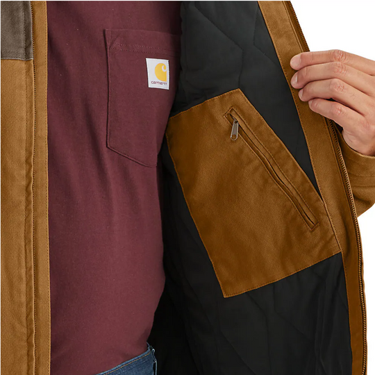 Carhartt Men's Montana Rugged Flex Duck Jacket - Carhartt Brown/Coffee on a male model on a white background. Zoomed in interior zip pocket. 