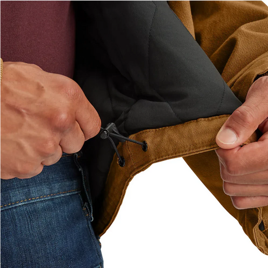 Carhartt Men's Montana Rugged Flex Duck Jacket - Carhartt Brown/Coffee on a male model on a white background. Zoomed in on bungee making the waist tighter. 