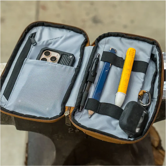 Carhartt Utility Soft Sided Organizer - Carhartt Brown. Showing the organizer opened up and filled with items. 