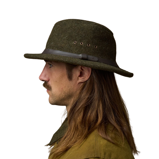 Filson Men's Mackinaw Wool Packer Hat - Forest Green on a male model on a white background.