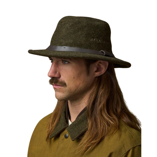 Filson Men's Mackinaw Wool Packer Hat - Forest Green on a male model on a white background.