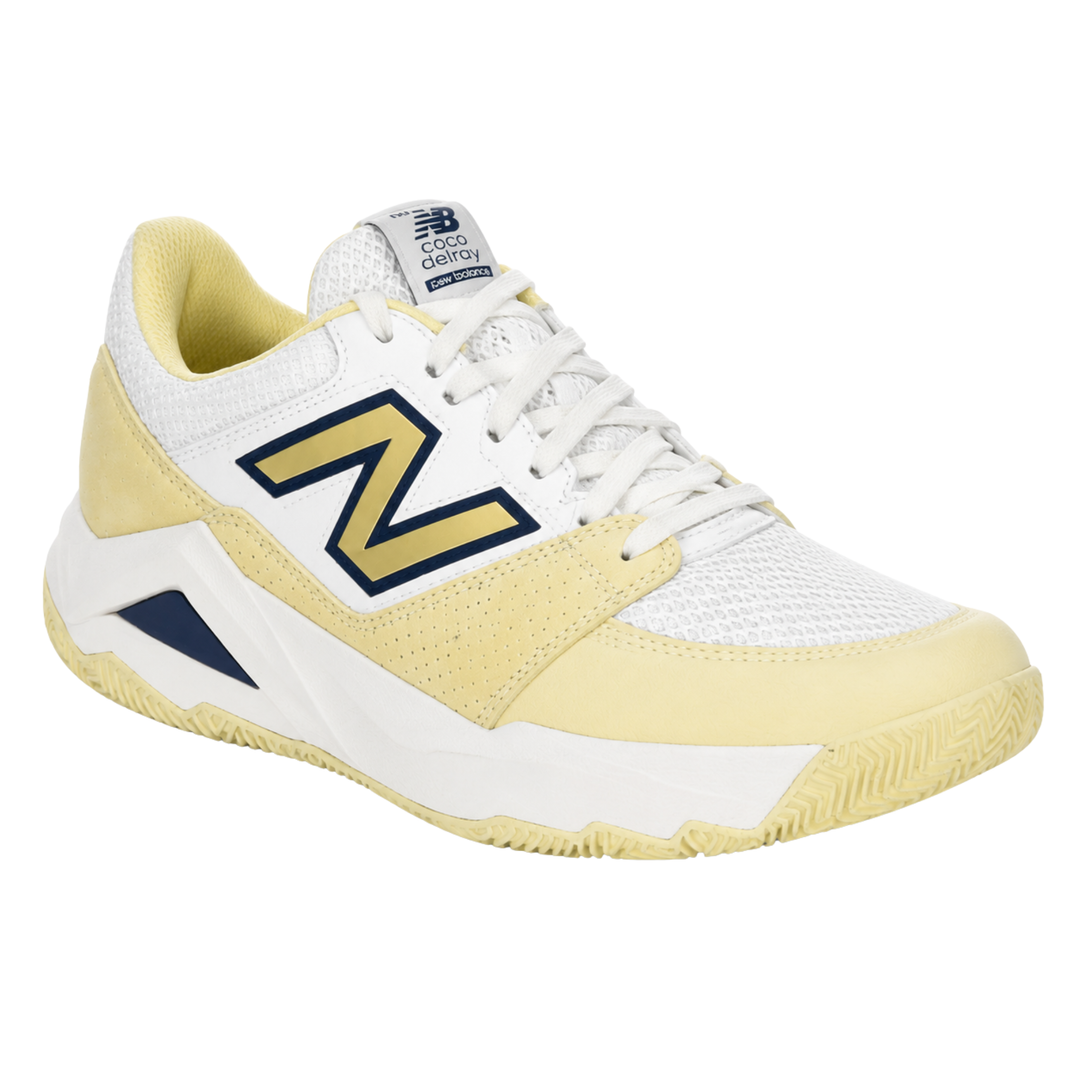 White and yellow sneaker with New Balance logo on a white background