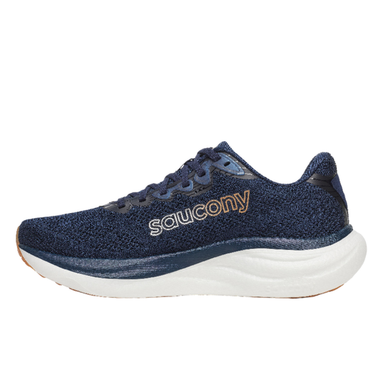 Navy running shoe with white sole on a white background