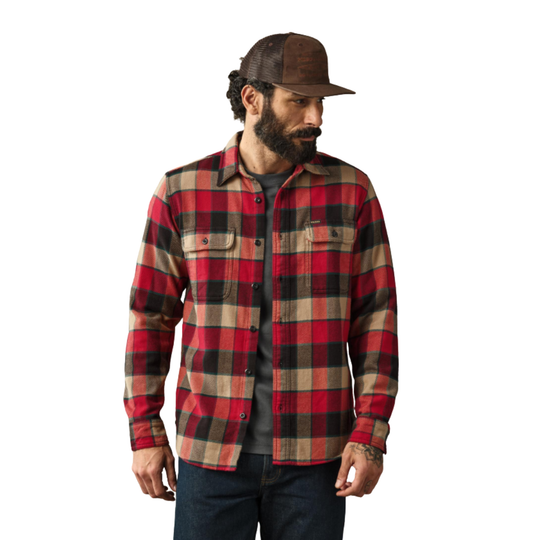 Man wearing a red and black plaid shirt with a brown cap on a white background
