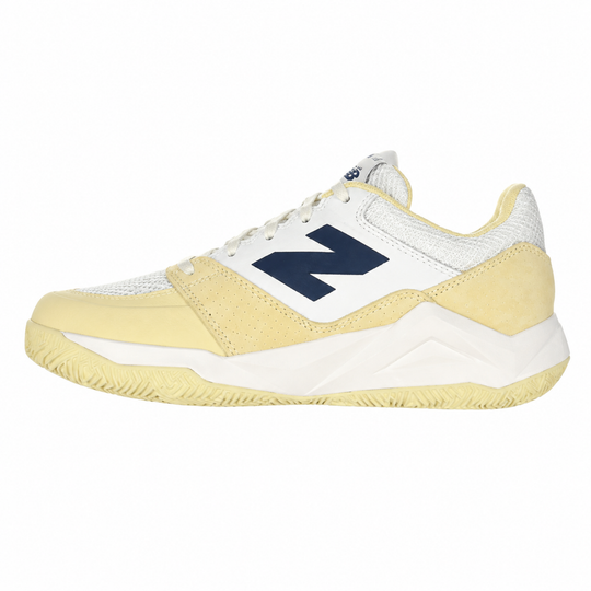 Yellow and white sneaker with a blue 'N' logo on a white background