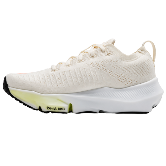 A white sneaker on a white background with DNA Tuned on the side of sole.