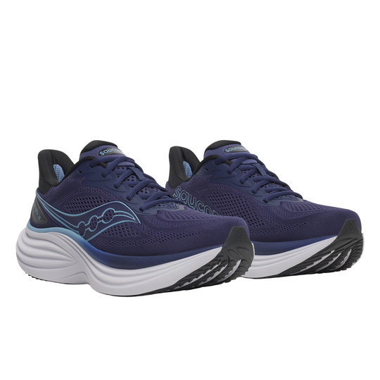 Pair of blue running shoes with white soles on a white background