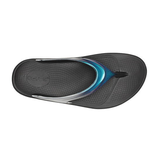 Black and blue sandal with 'Oofos' branding on a white background