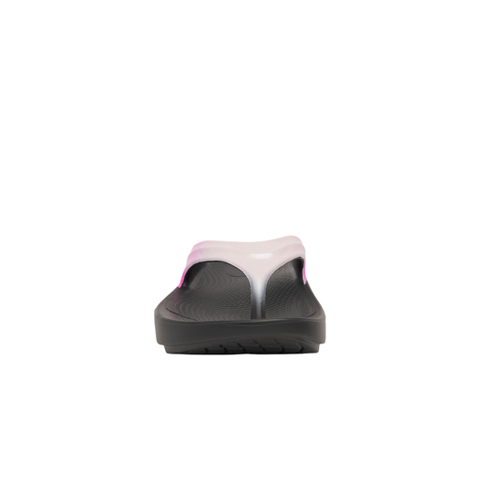 Black sandal with pink toe cover on a white background