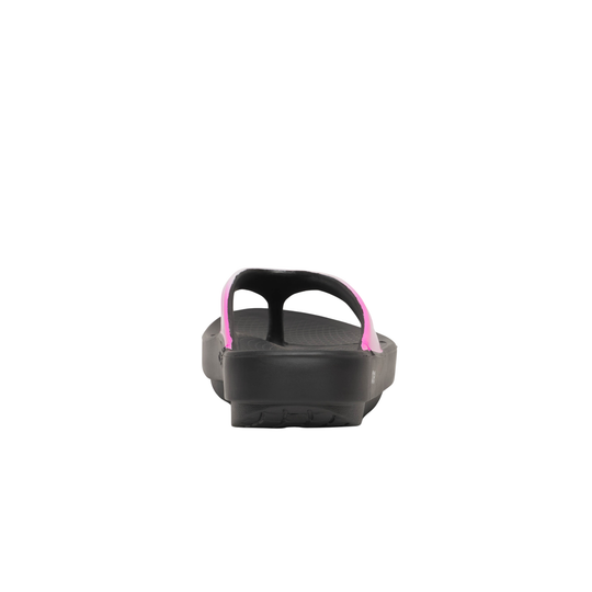Black sandal with pink straps on a white background