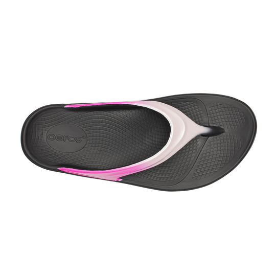 Black and pink sandal with 'Oofos' branding on a white background