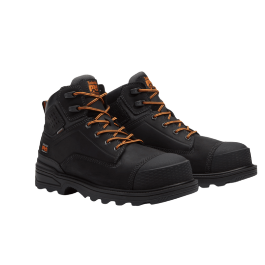 Pair of black boots with orange laces on a white background