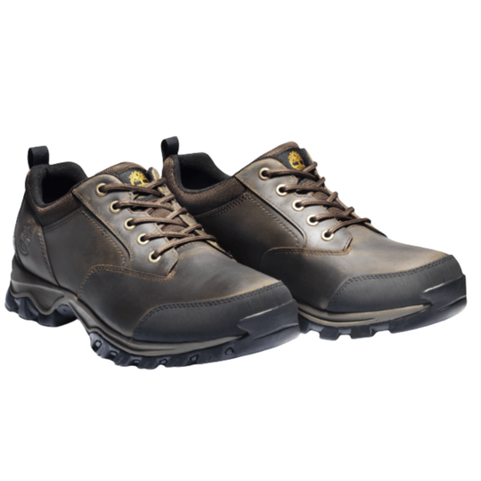 A pair of brown hiking shoes on a white background