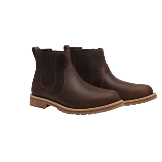 Pair of brown slip on boots on a white background