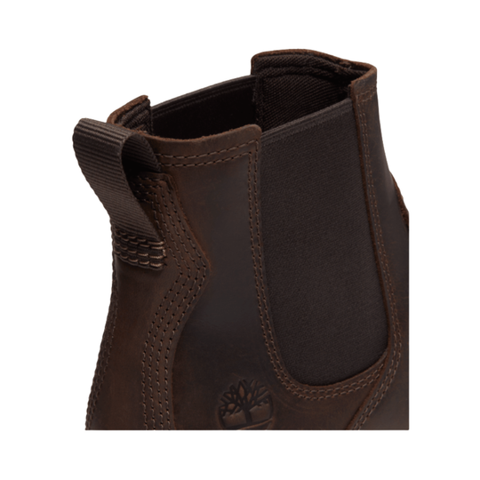 Close-up of a brown leather boot with a visible brand logo on a white background