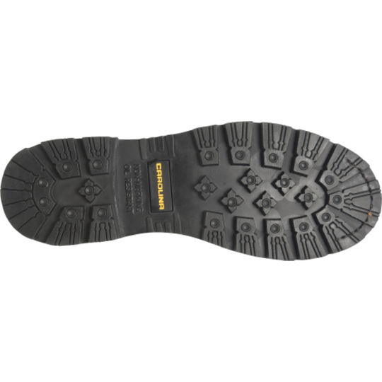Close-up of a black boot sole with a brand logo on a white background