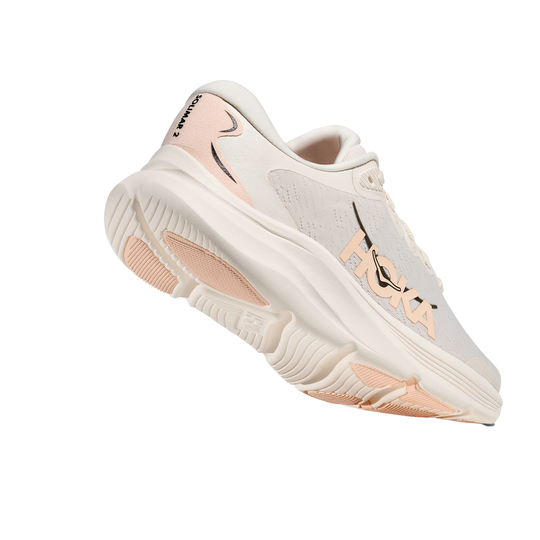 White sneaker with pink accents on a white background