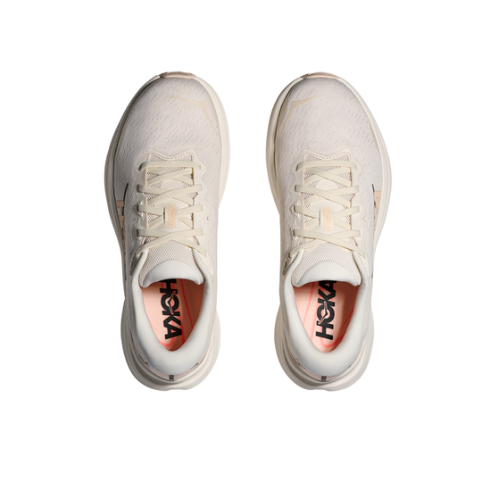 Pair of white running shoes with 'Hoka' branding on a white background