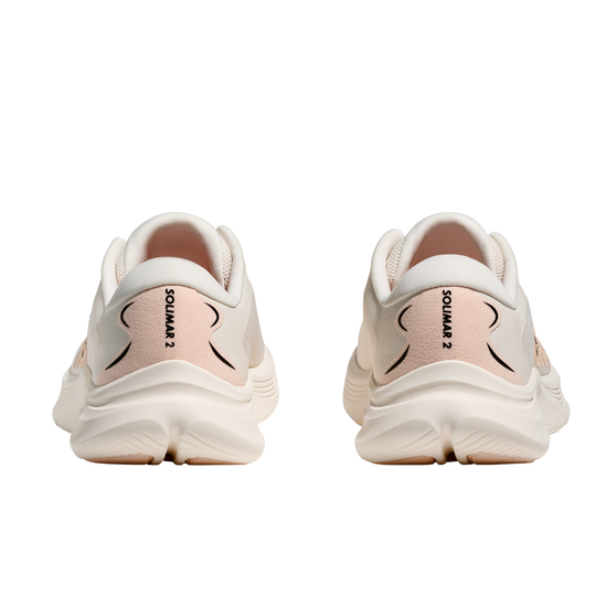 Pair of white running shoes with 'Solimar ' branding on a white background