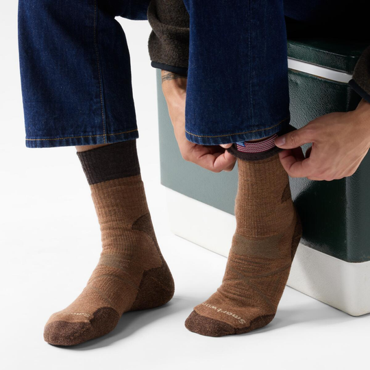 Person wearing mocha socks with a white background