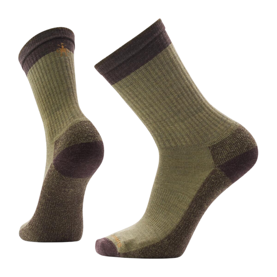 Pair of green socks with brown accents on a white background