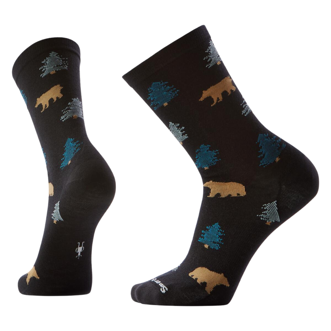 Black socks with bear and tree pattern on a white background