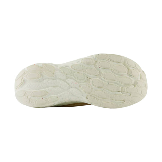 Off-white shoe outsole with speckled flecks and rounded tread pattern