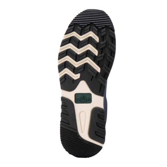 Close-up of a shoe sole with a brand logo on a white background