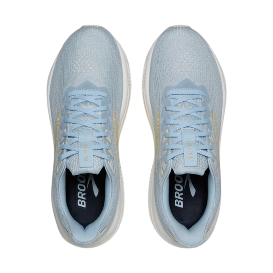 Light blue running shoes with white soles on a white background