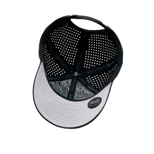 Black and white cap with mesh back on a white background