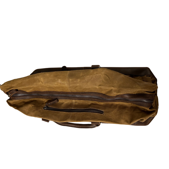 Brown leather duffel bag on a white background
