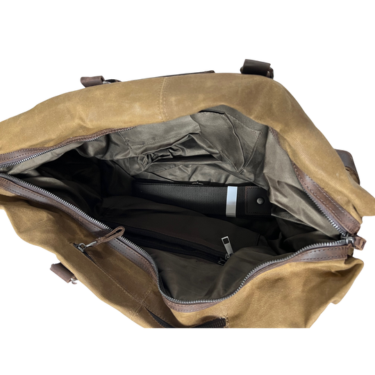Open beige bag with a black item inside on a white background