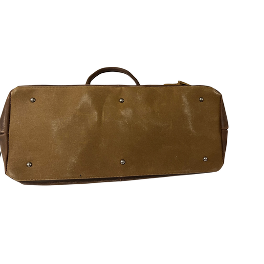 Brown leather bag with rivets on a white background