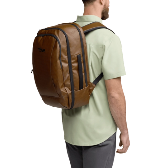 Man wearing a brown backpack on a white background