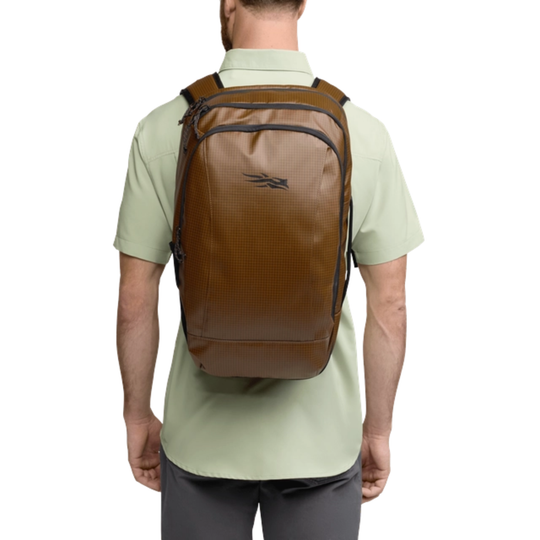 Man wearing a brown backpack on a white background
