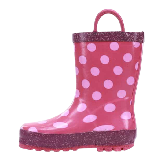 Pink polka dot rain boot with a handle on a white background