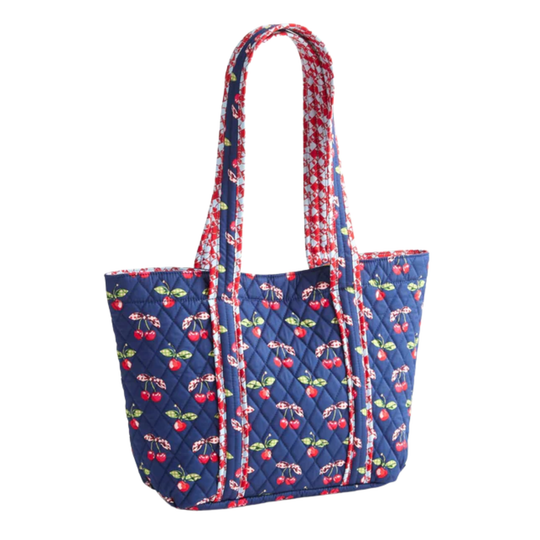 Quilted tote bag with cherry pattern on a white background