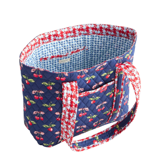 Quilted tote bag with cherry pattern on a white background