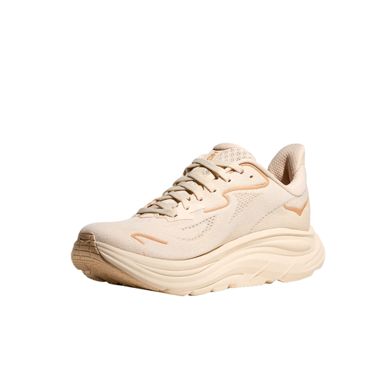 Light beige running shoe with thick cushioned sole and lace-up upper on a white background