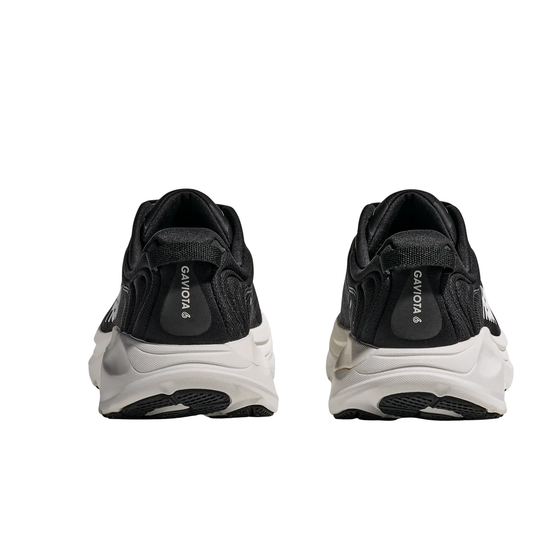 black hoka shoe with white sole