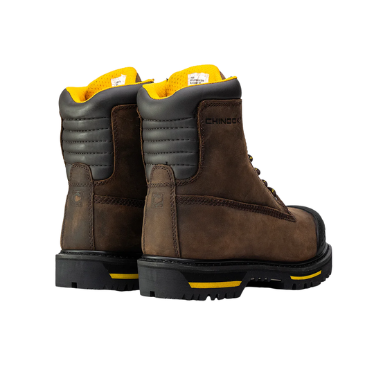 Pair of brown work boots with yellow accents on a white background
