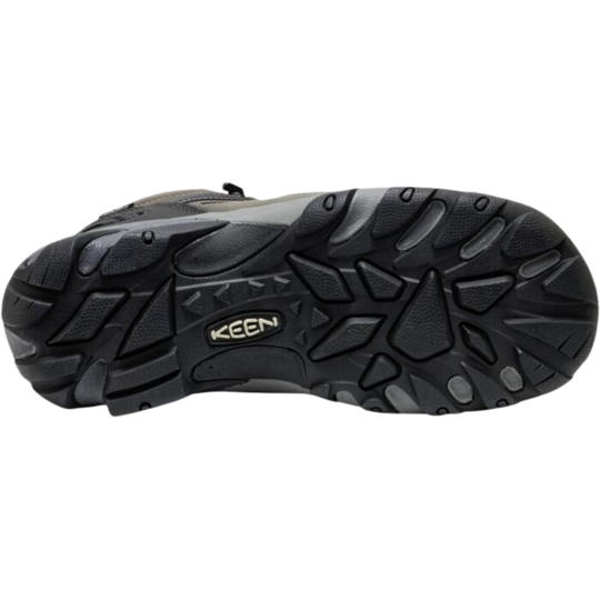 Black hiking boot outsole with deep tread and a KEEN logo