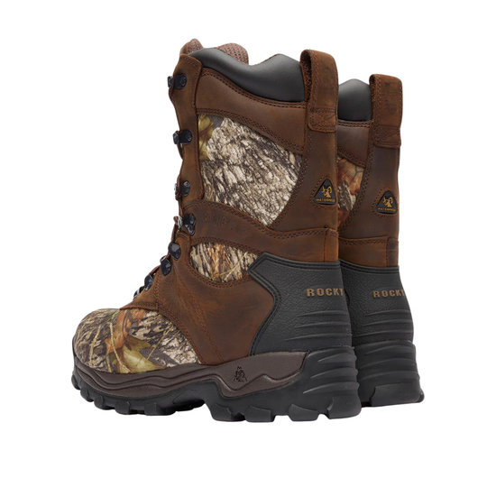 Pair of hunting boots with camouflage pattern and brand logo on a white background