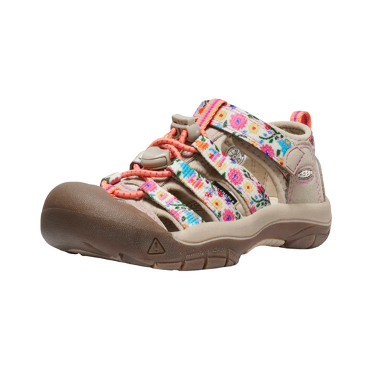 Children's sandal with floral pattern and orange laces on a white background