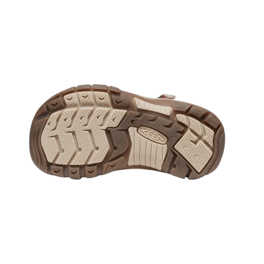 Close-up of a brown and beige shoe sole with K-Swiss logo on a white background