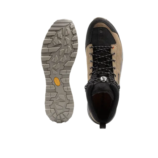 Hiking boot with sole showing brand logo on a white background