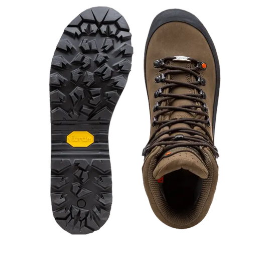 Brown hiking boot with laces on a white background