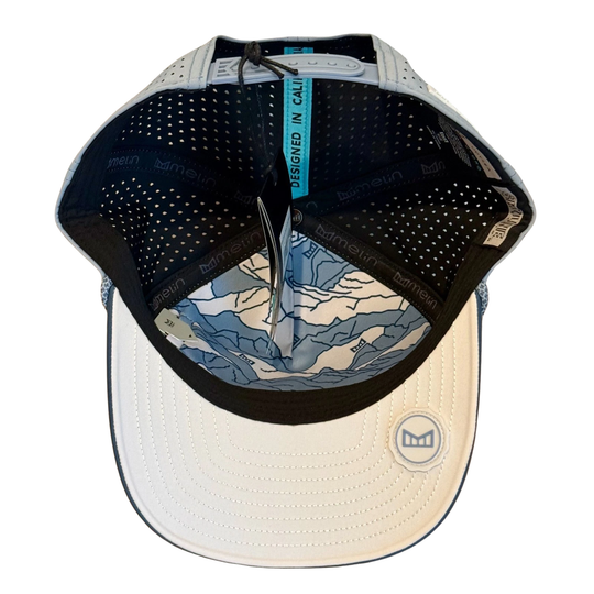 Baseball cap with a map design on the visor against a white background