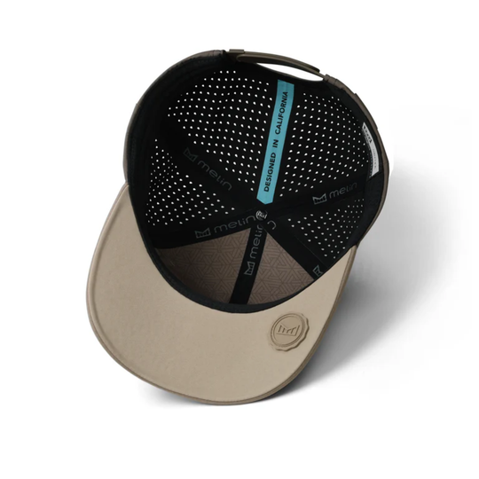 Beige and black cap with mesh design on a white background